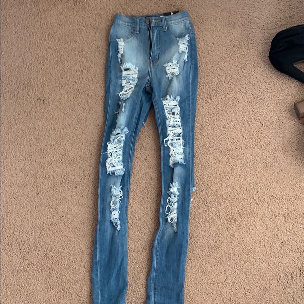 Distressed medium blue wash skinny jeans